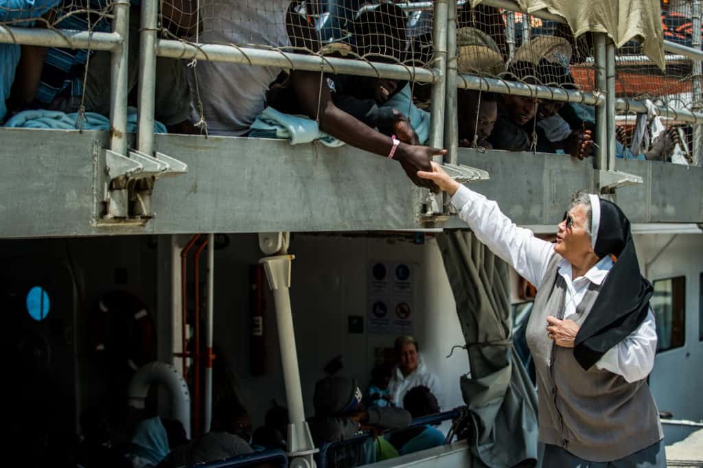 Migrants and Nun